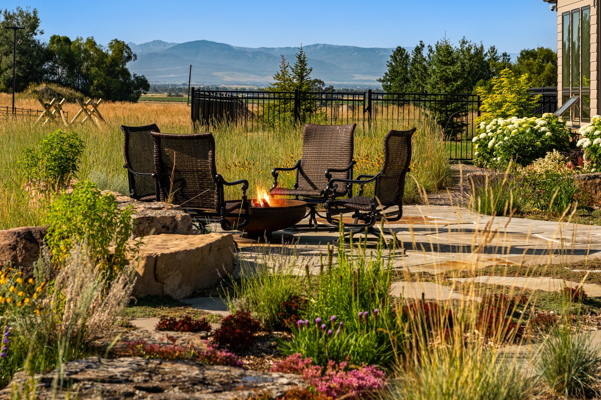 Backyard patio with fire pit and mountain view