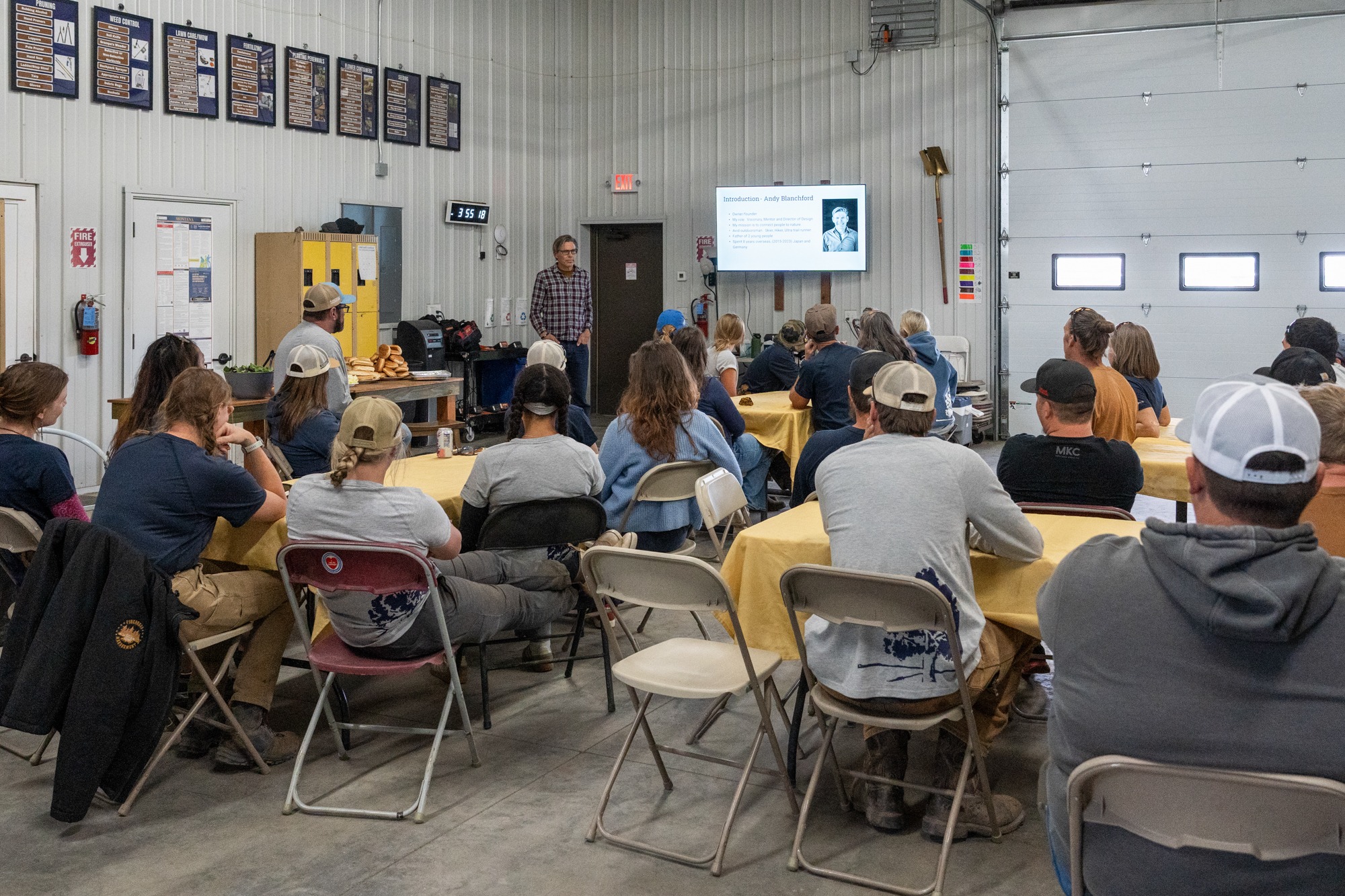 Man presenting to group in workshop meeting space