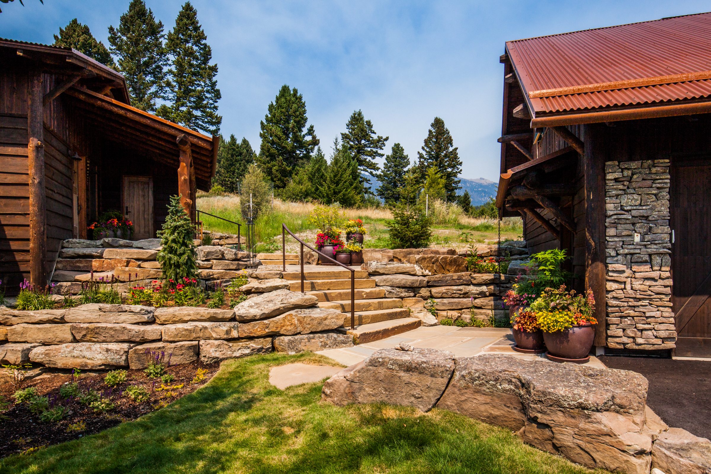 Rustic cabins with stone steps and landscaped garden