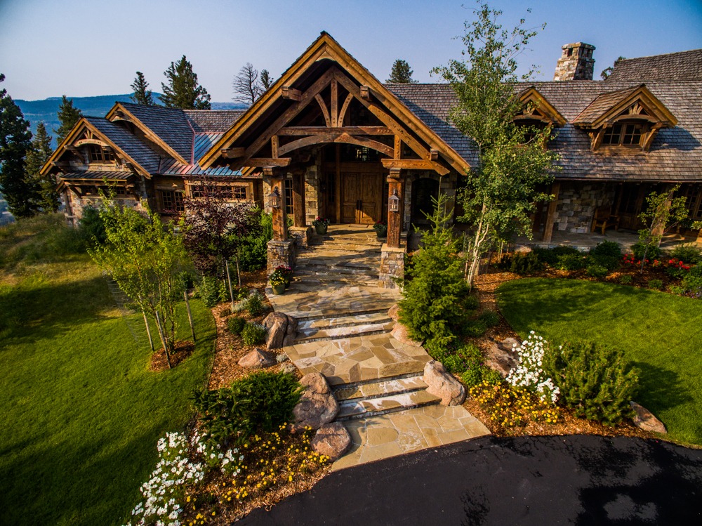 Rustic timber and stone mountain home exterior