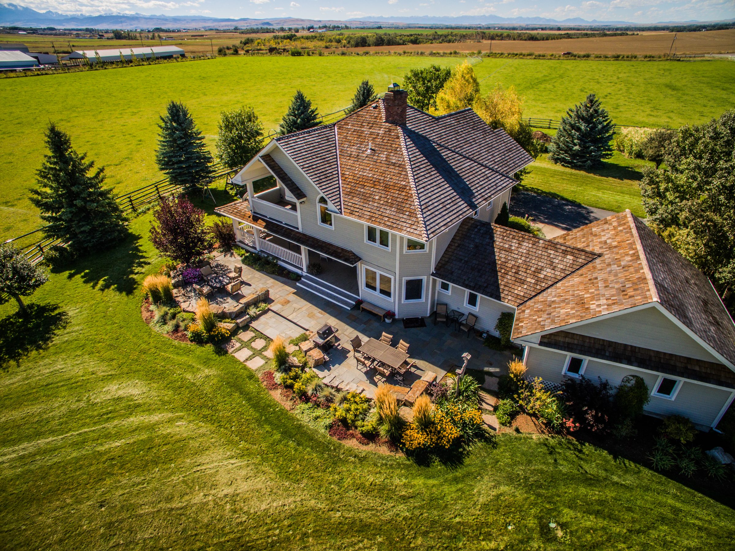 Aerial view of countryside home with landscaped backyard