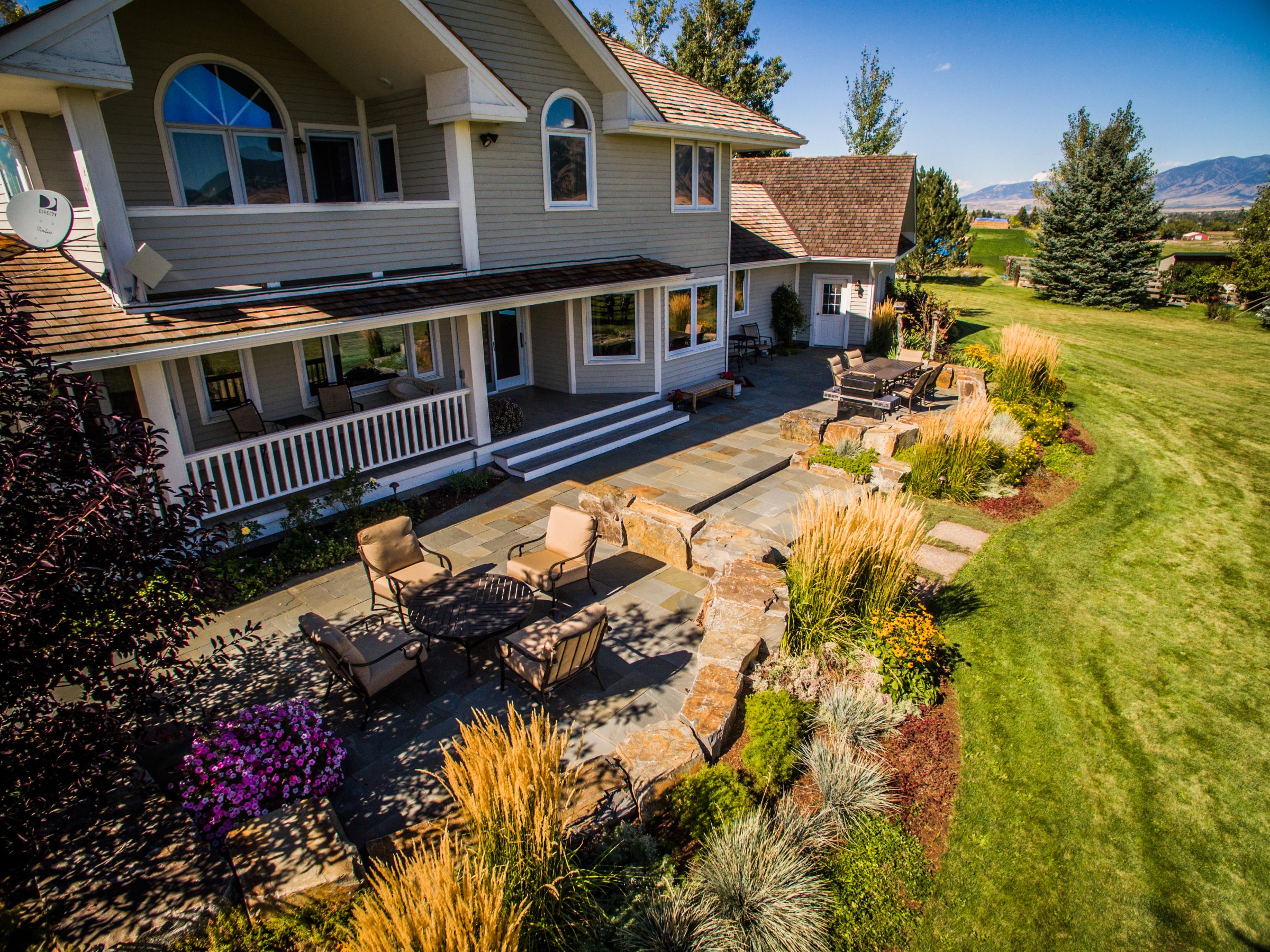 Spacious home with landscaped backyard patio and lawn