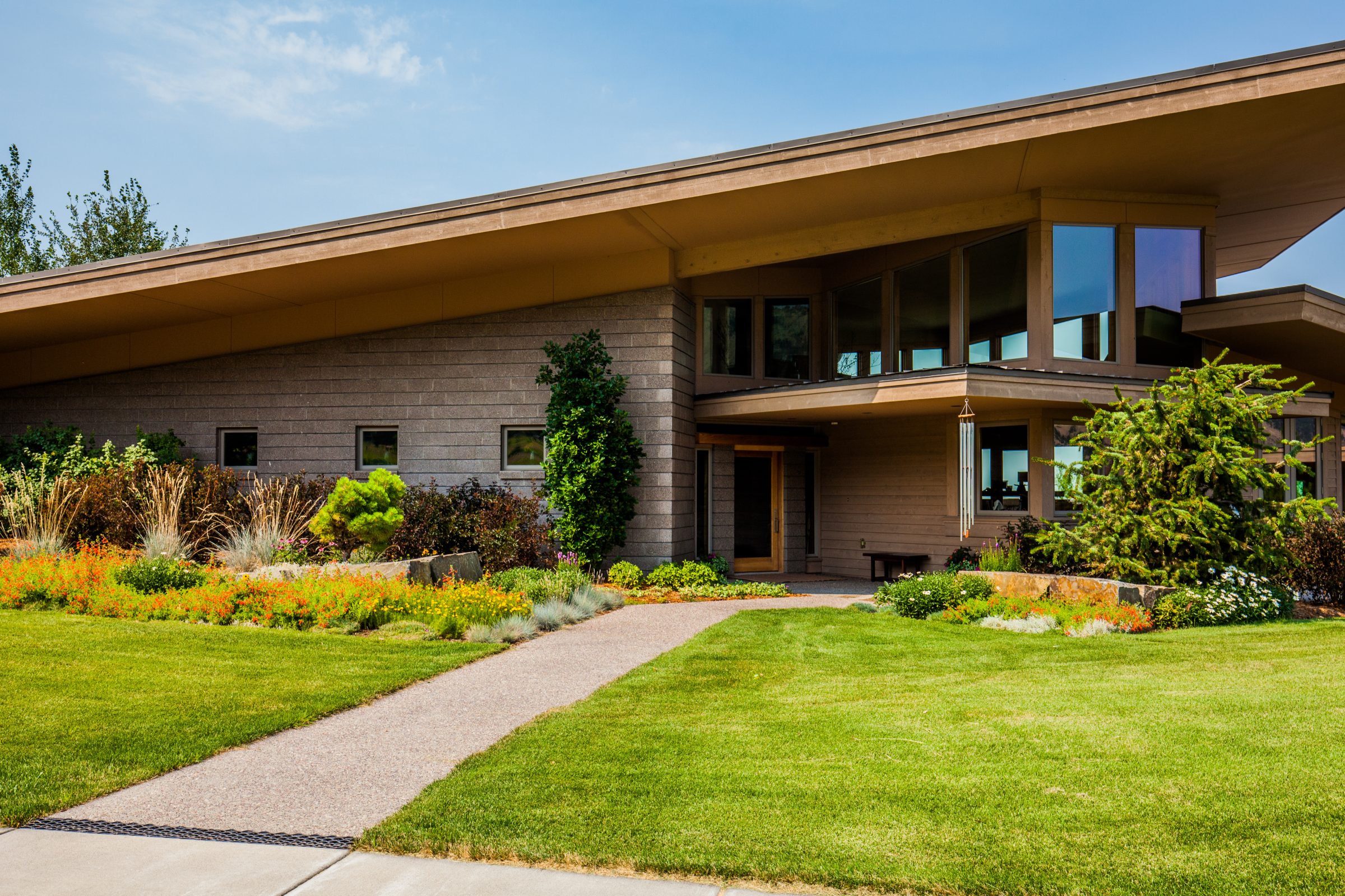 Modern home with landscaped garden and slanted roof