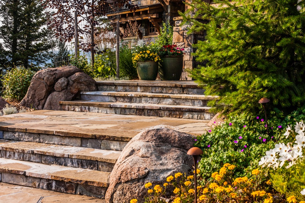 Stone steps with flowers and landscaped garden