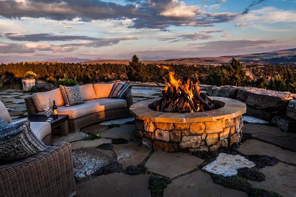 Stone fire pit on scenic sunset patio