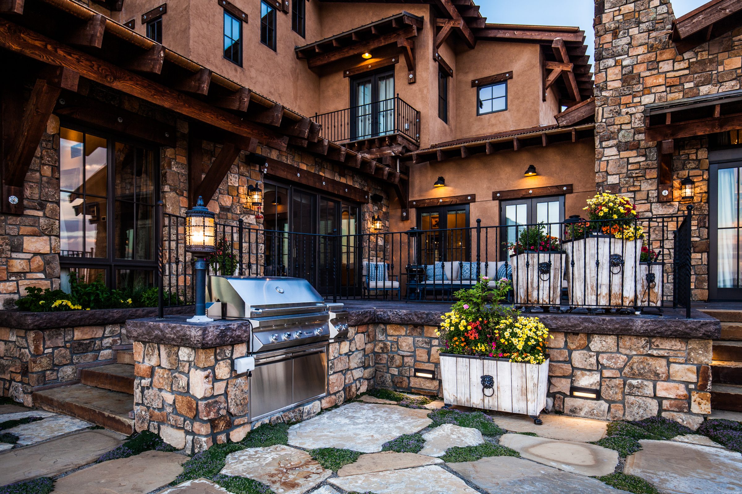 Luxury stone patio with built-in grill and balcony