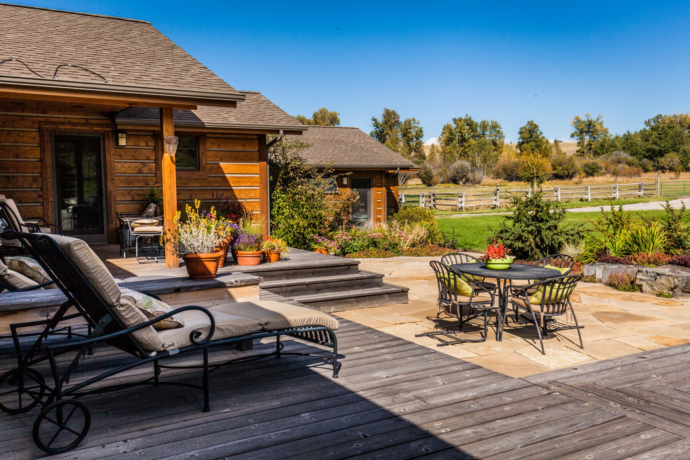 Rustic wooden house with patio and garden