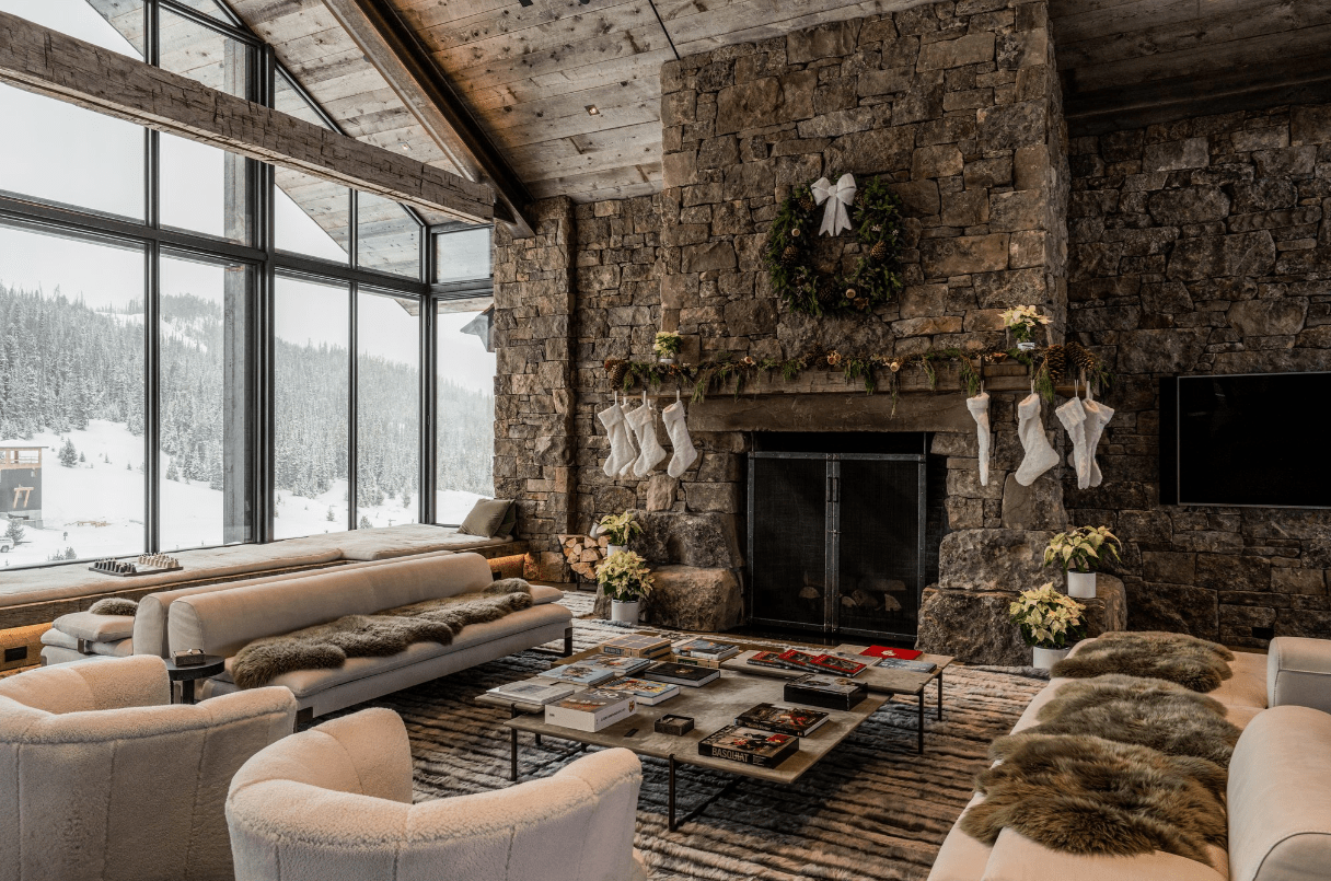 Cozy mountain living room with stone fireplace