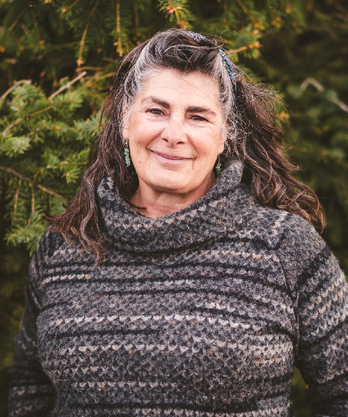 Smiling woman in patterned sweater outdoors